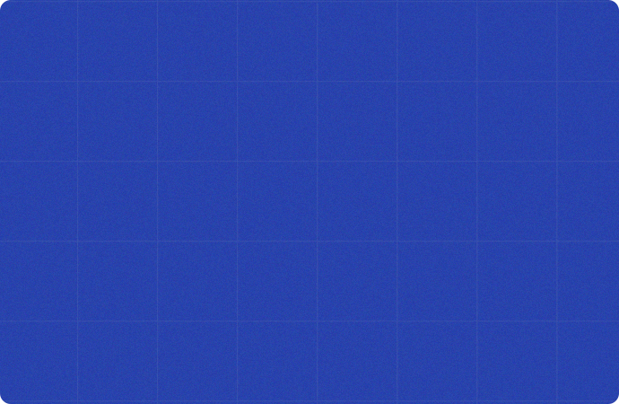 A scenic view of a rolling green park with clear blue skies. There is a large, curving pathway and numerous people strolling or relaxing. The skyline of several tall buildings can be seen in the distance, creating an urban backdrop to the natural setting. - Assirience Consulting